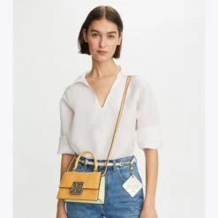 Tory Burch Bon Bon Textured Patent Mini Top-Handle Bag 13 Tory Burch Bon Bon Textured Patent Mini Top-Handle Bag -Chic Style Shop Bon20Bon20Textured20Patent20Mini20Top Handle20Bag.TB 153235 800 20230310 OMACC.pdp 1200x1200 1