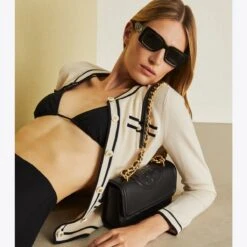 Tory Burch Small Fleming Convertible Shoulder Bag 26 Tory Burch Small Fleming Convertible Shoulder Bag -Chic Style Shop Small20Fleming20Convertible20Shoulder20Bag.TB On Model Editorial 20230601 EOMS.pdp 1200x1200 1